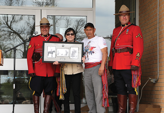 Left: Corporal Brett Church and Staff Sargent Matt Lavallee gifted a traditional RCMP Print to Leah LaPlante and Terry Haney of MMFS. The back of the gift states,“Presented to MMFS Fort-Ellice local in recognition for your continued support and partnership with Prairie Mountain RCMP, thank you.”